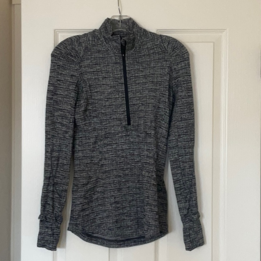 EUC.  1/2 zip with ruffle detail at wrists.